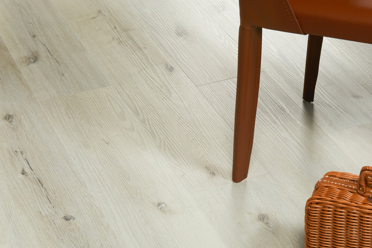 Close-up of Nordikka Select White Ash plank flooring, pale tones with soft knotting